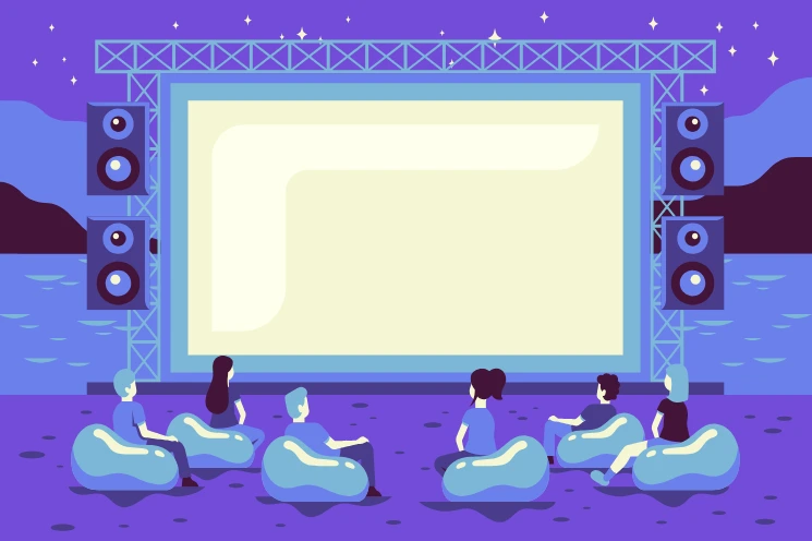 A group of people watching a movie in a cinema, illustrating the importance of film festivals as launchpads for independent films